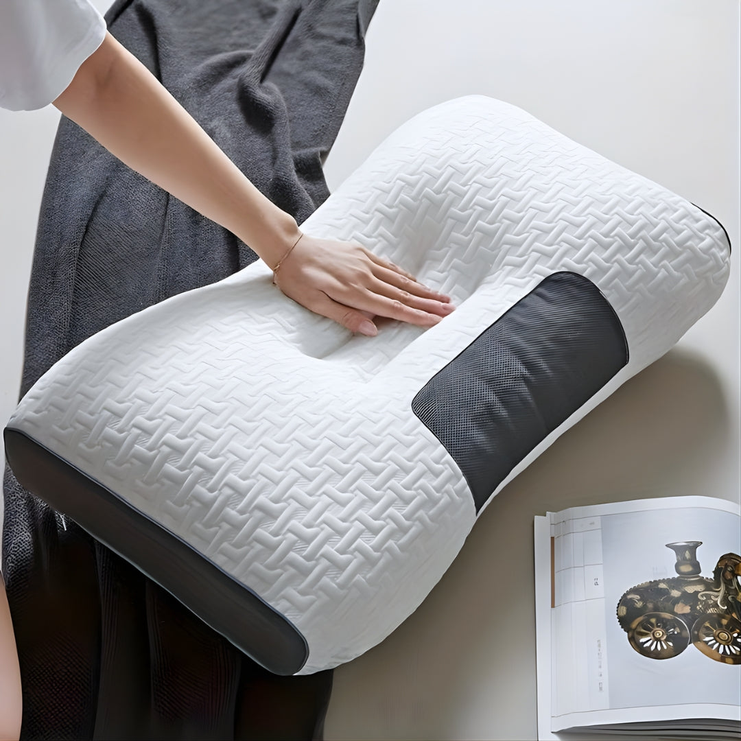 An image showing a hand on top of an ergonomic cervical support pillow for side sleepers.